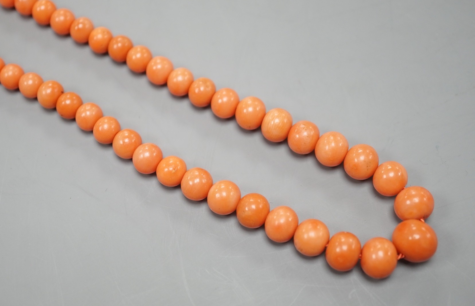 A single strand graduated coral bead necklace, 48cm, gross 29 grams.